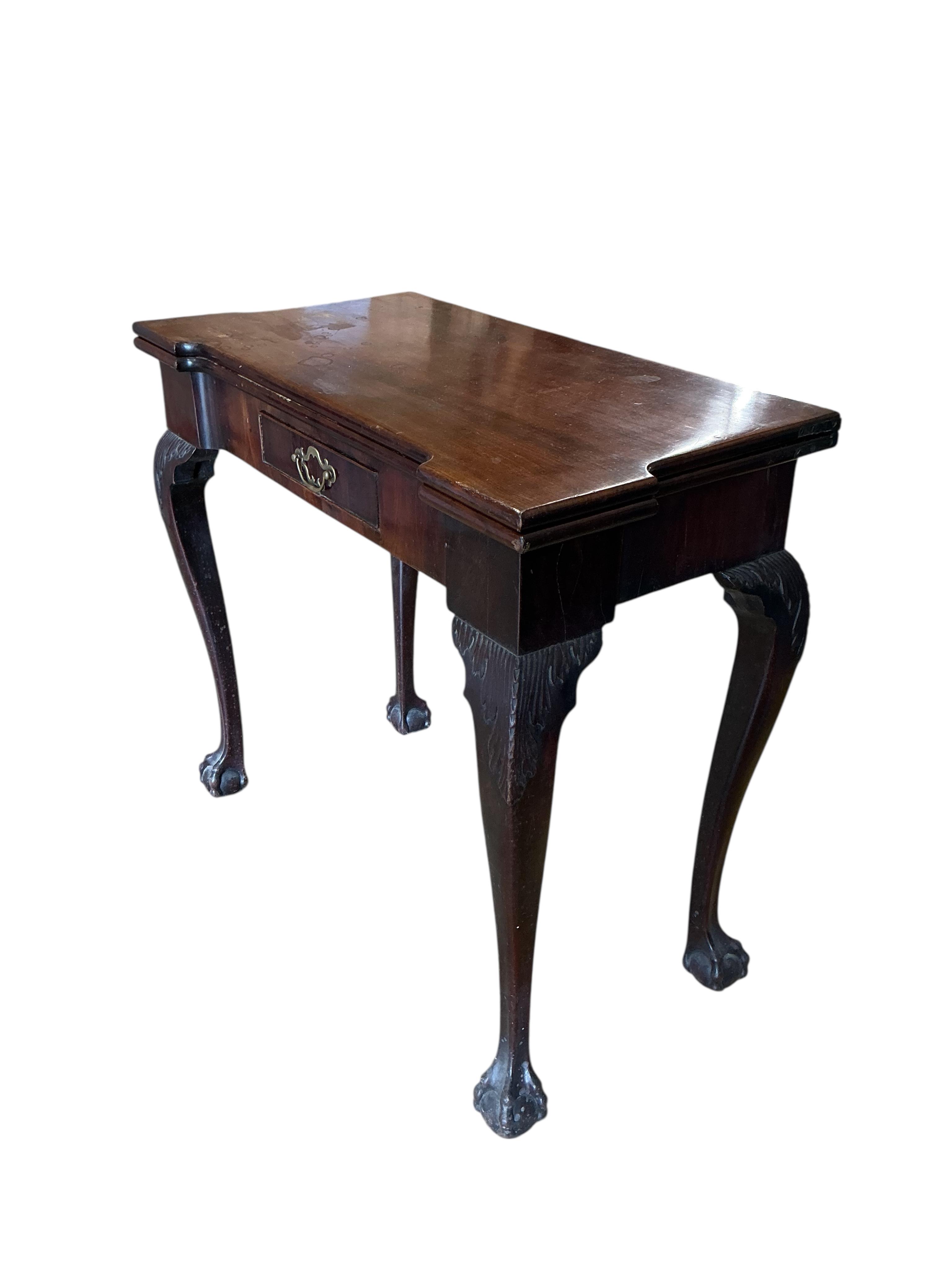 An 18th century rectangular mahogany folding tea table, width 80cm, depth 40cm, height 72cm
